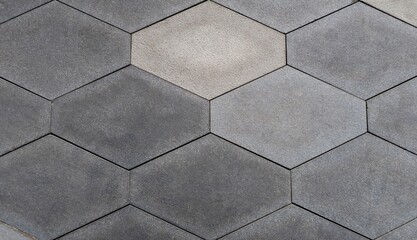 Hexagonal paving stones on the street of the city. Close-up.