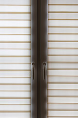 window closed role shutters light yellow striped