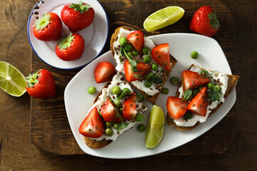 Homemade strawberry bruschetta with green pea