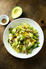 Healthy salad with duck, pineapple and avocado