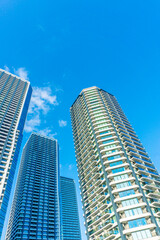Fototapeta premium Exterior of high-rise condominium and refreshing blue sky scenery_c_59