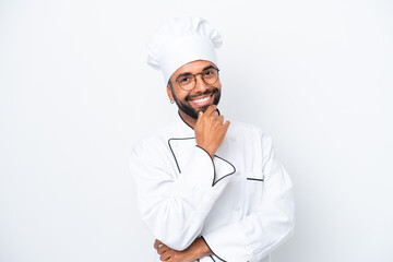 Young Brazilian chef man isolated on white background with glasses and smiling