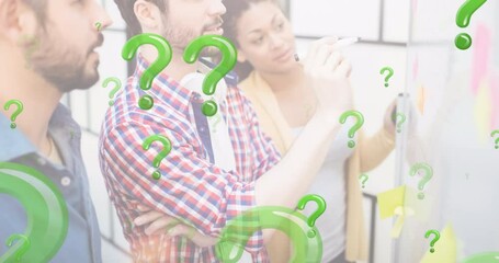 Animation of green question marks over business people looking at memo notes - Powered by Adobe