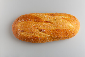 fresh white bread on white background top view