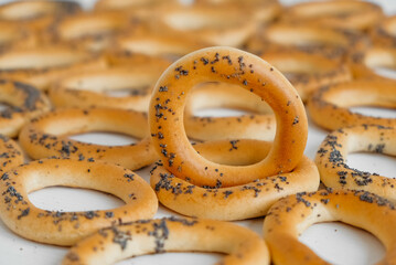 Dried bagels with poppy seeds on a white background