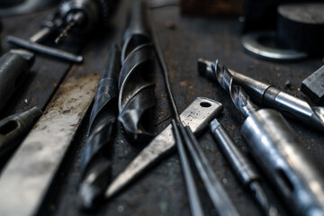 Close up of industrial tools indoors in metal workshop.