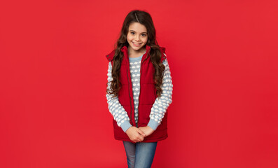 express positive emotion. winter fashion. happy cute kid with curly hair. female fashion model.