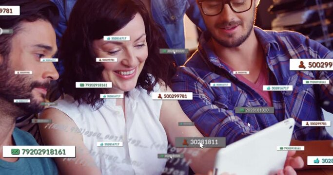 Animation of social media icons and numbers over business colleagues using laptop - Powered by Adobe