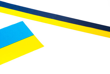 Colorful blue-yellow fabric ribbon and flag of Ukraine isolated on white. The symbol of the state. National pennant