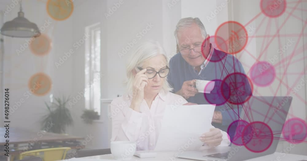 Wall mural Animation of media icons over senior caucasian couple using laptop