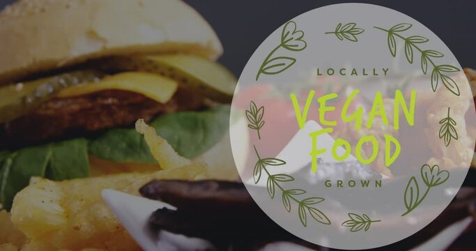 Animation of vegan food text over fresh hamburger