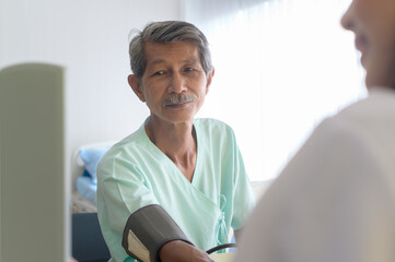 Fototapeta premium Asian senior male patient is consulting and visiting doctor in hospital....