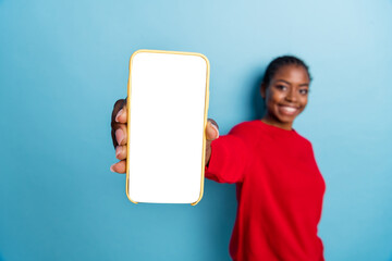 Photo of sweet young brunette lady show telephone wear red pullover isolated on blue color background
