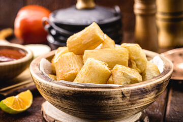 large portion of fried cassava, in a rustic rural setting, typical food from the state of minas Gerais, brazil