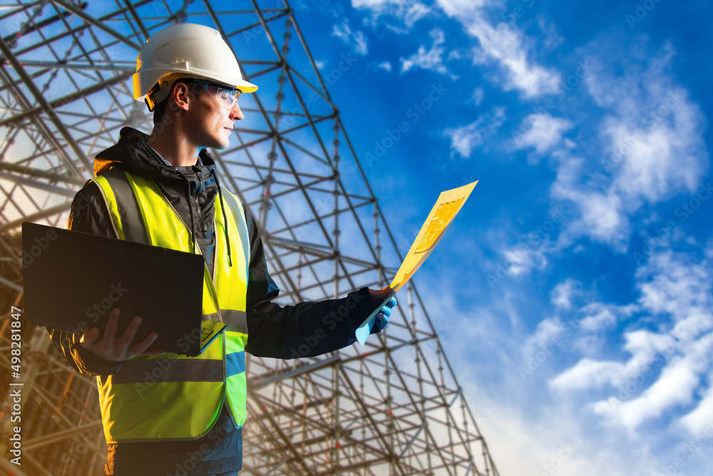 Aufkleber builder man. architect with laptop. construction drawings in hands of engineer. builder next to meta