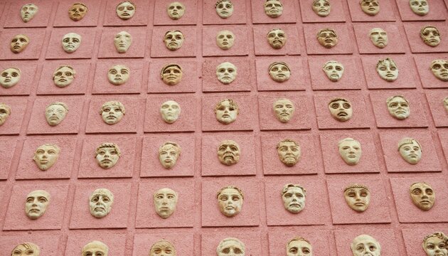 Tragicomic Theater Masks. Tragedy and comedy grotesque masks. 3D images on a wall