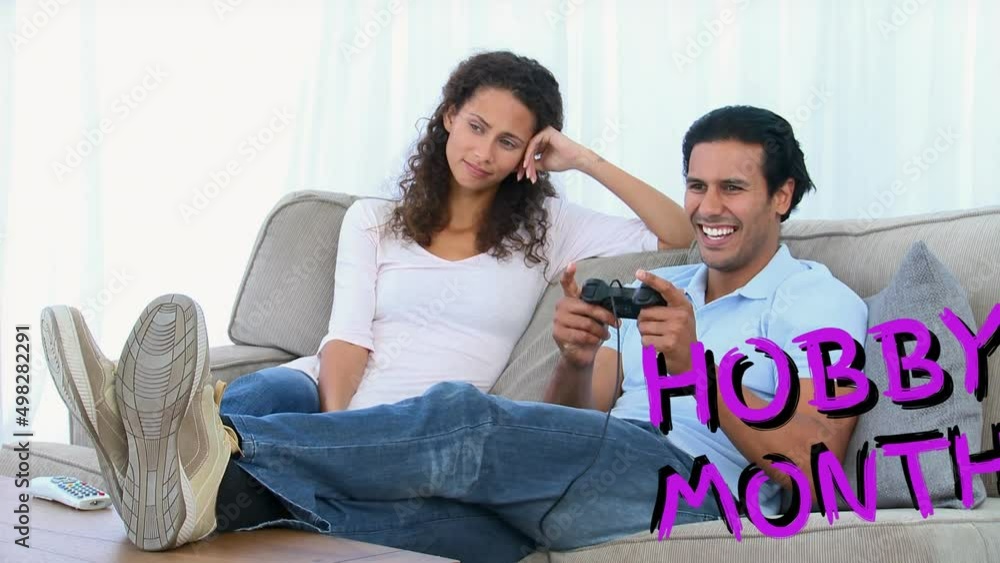 Poster animation of hobby month text over couple using game console