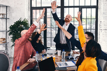 Group of joyful smiling happy people celebrate win with arms up. Mediation offer high five friendship deal achievement strike bargain good news friendly consent successful effective strategy