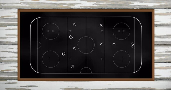 Animation of sports tactics over game pitch on blackboard background