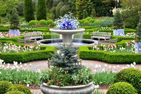 Springtime garden with a fountain 