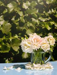 A small bouquet of flowers in a transparent circle. A summer day.