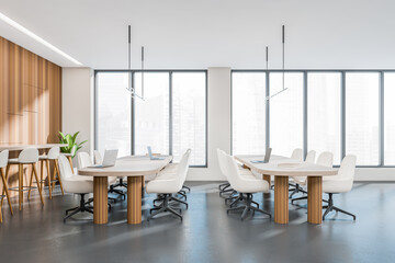 Side view on bright office room interior with panoramic windows