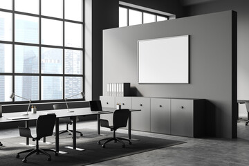 Corner view on dark office interior with empty white poster