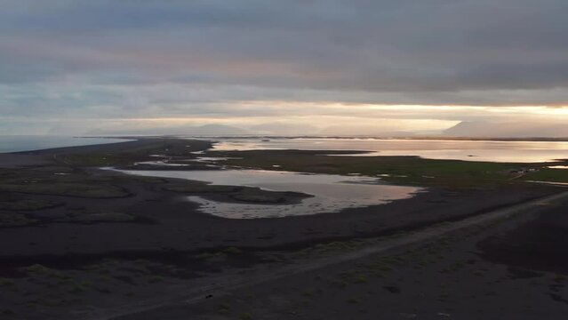 Drone Over Black Sand Beach At Sunset Towards Vestrahorn
