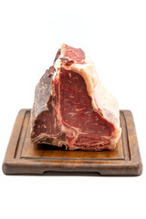 Dry-aged Raw T-bone or porterhouse beef meat Steak with tomatoes and peppers. white background. Yakın çekim