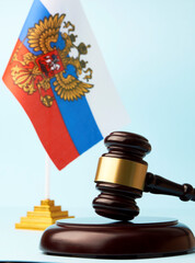 lag of Russia and judge gavel on blue background