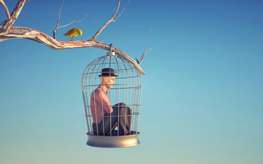 Man inside a bird cage in a tree. - obrazy, fototapety, plakaty