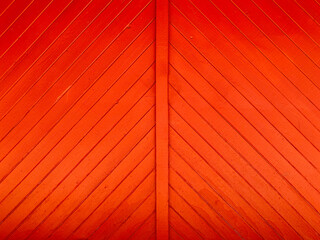 bright red sunny barn painted fresh paint farm barn door wood plank boards stable wall