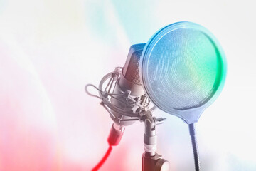 Close-up of a professional microphone with a pop filter in front of it. Toned photo of a microphone...