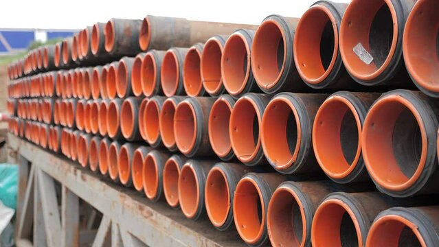 The top drive system of a drilling rig. The oil pipes are in a row