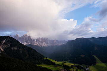Sunset and rainbow in Val Di Funes, Dolomites, Alps, Italy