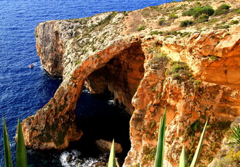 Blue grotto, rock and calm blue sea on the island of Malta