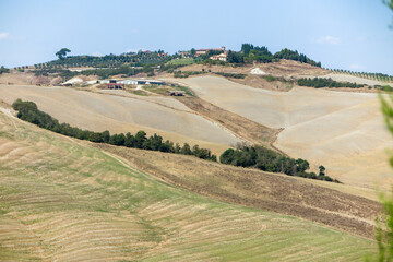 View of a wine-producing farmhouse in the Tuscany region in the dry season.