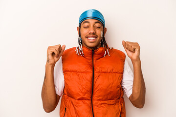 Young African American man isolated on white background celebrating a victory, passion and enthusiasm, happy expression.