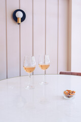 Two glasses with white wine on table