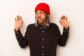 Young African American man isolated on white background being shocked due to an imminent danger