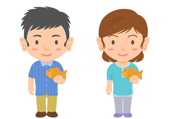 たい焼きを食べる男女
