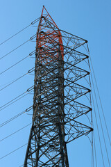 High voltage cables on a tall electric pylon