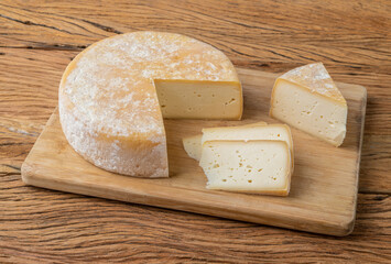 Artisanal Canastra cheese from Minas Gerais, Brazil over wooden table