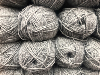 close up of skeins of grey wool taken front on no people