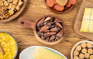 Typical brazilian june festival food over wooden table. Festa junina