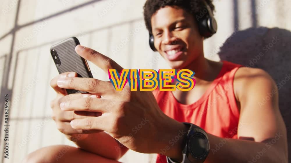 Poster animation of vibes text over smiling african american man using smartphone