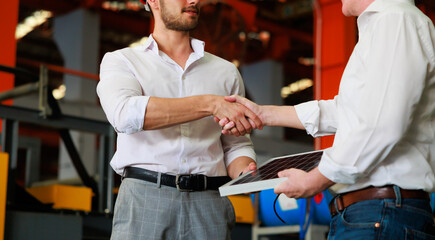 Electrical Engineer Technician and CEO executive business people making handshake after meeting. clean and green alternative energy concept.
