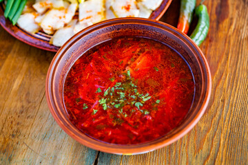 Borscht is a traditional Ukrainian food made from meat, beets, potatoes, carrots and greens. 