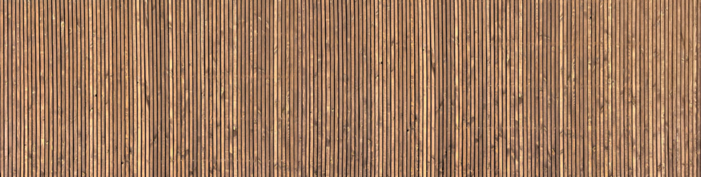 Wooden decorative carved building facade or fence, wooden planks. Pattern or texture