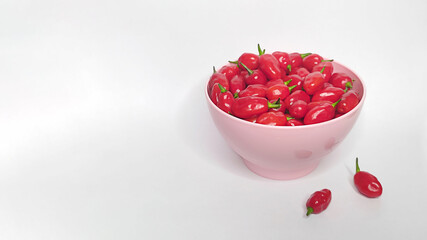 Red peppers in the bowl with white background. Space for text